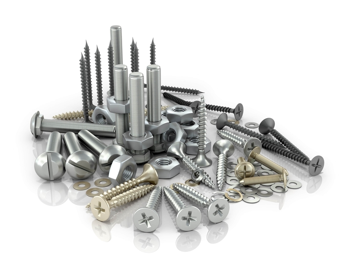 Fasteners, bolts, nuts and screws and screws on a white background.